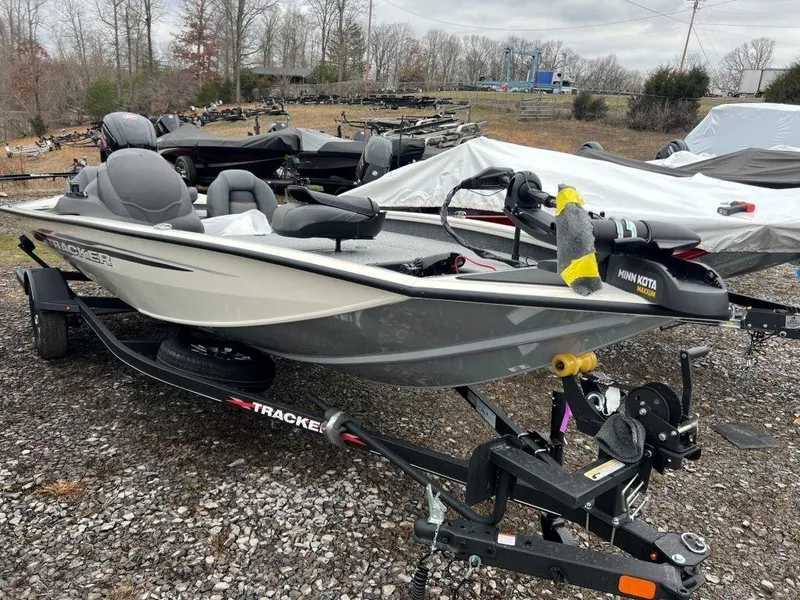 The Image of 2023 Tracker Pro Team™ 190 TX fishing boat on trailer in outdoor lot. - 0