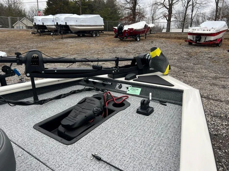 Slide: The Image of 2023 Tracker Pro Team™ 190 TX boat deck with trolling motor and control panel. - 4