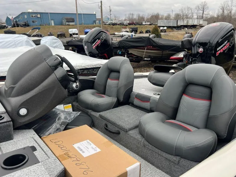 Slide: The Image of 2023 Tracker Pro Team™ 190 TX boat interior with gray seats and steering console. - 5