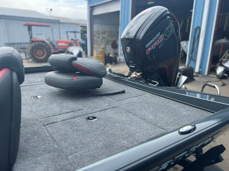 Slide: The Image of 2023 Ranger RT188P boat with Mercury Pro XS engine in a workshop setting. - 3