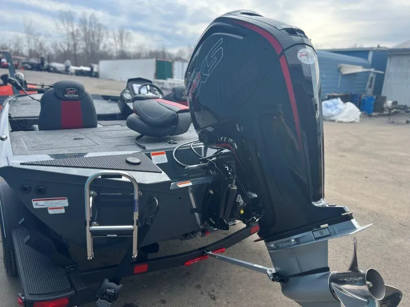 Slide: The Image of 2023 Ranger RT188P boat with powerful outboard motor, parked outdoors. - 6