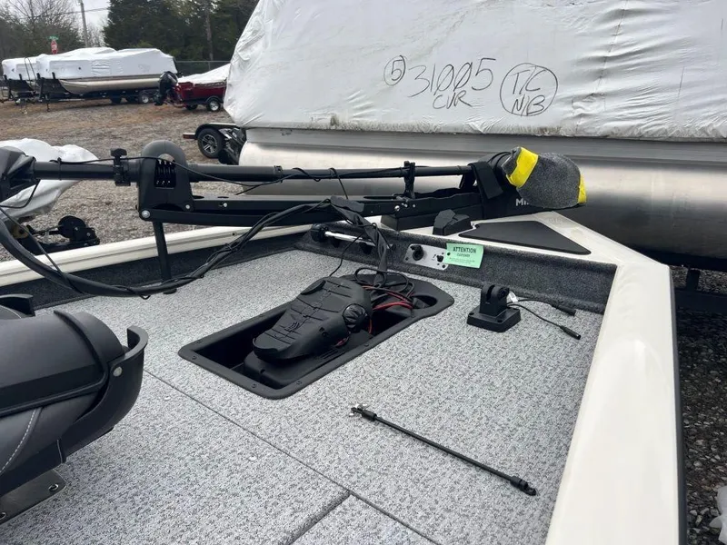 Slide: The Image of 2023 Tracker Pro Team 175 TXW® boat deck with trolling motor and storage compartment. - 3