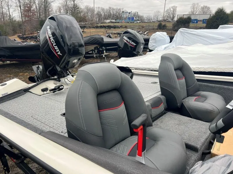 Slide: The Image of 2023 Tracker Pro Team 175 TXW® boat with Mercury engine, gray seats, and red accents. - 4