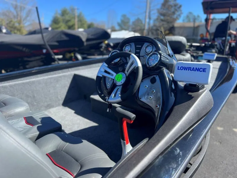 Slide: The Image of 2023 Tracker Pro Team 175 TXW® boat interior with steering wheel and Lowrance electronics. - 4