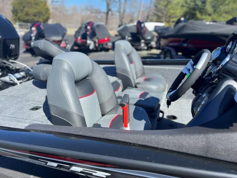 Slide: The Image of 2023 Tracker Pro Team 175 TXW® boat interior with gray seats and steering wheel. - 8