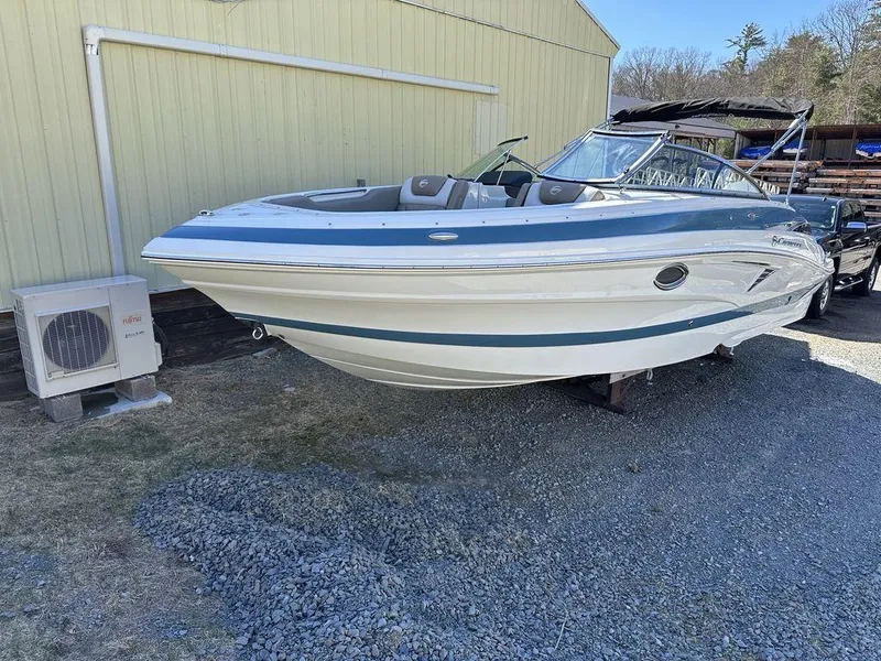 Slide: The Image of 2024 Crownline XSS Series 250 boat on display outdoors. - 1