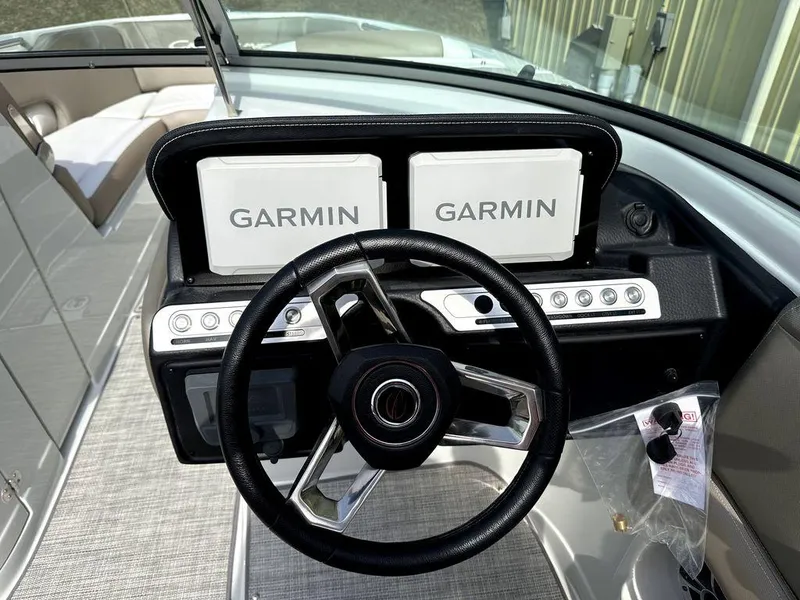 Slide: The Image of 2024 Crownline XSS Series 250 boat dashboard with Garmin navigation system. - 12