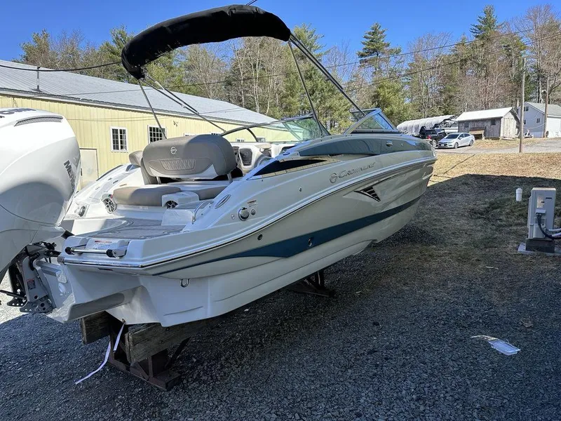Slide: The Image of 2024 Crownline XSS Series 250 boat on display outdoors. - 2