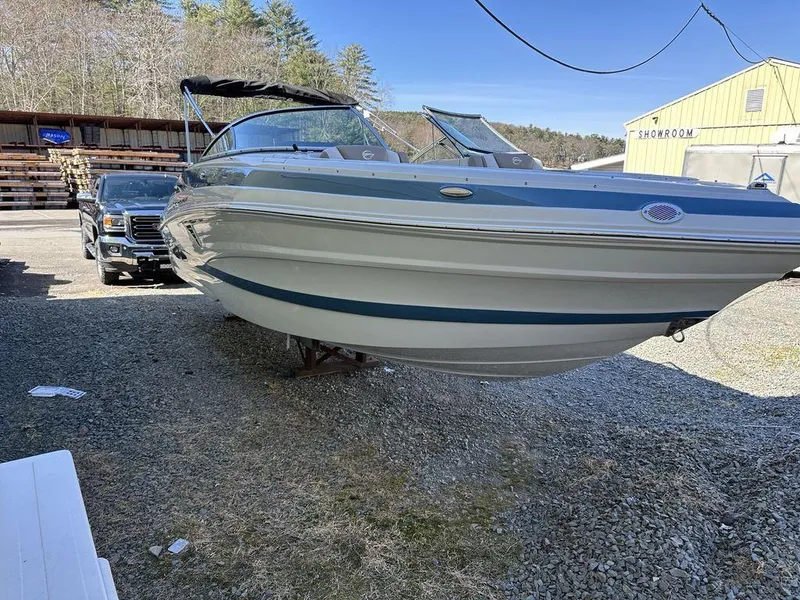 Slide: The Image of 2024 Crownline XSS Series 250 boat on display outdoors. - 3