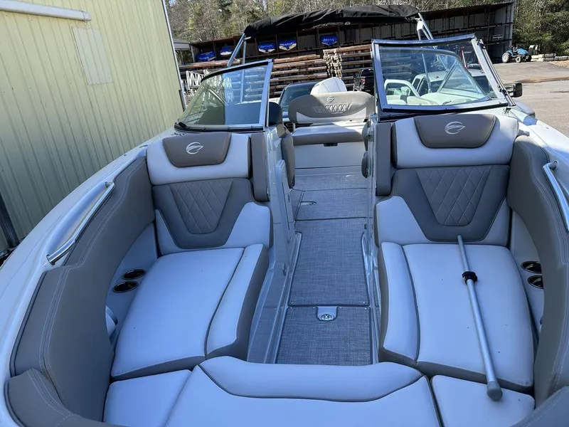 Slide: The Image of 2024 Crownline XSS Series 250 boat interior with white and gray seating. - 5