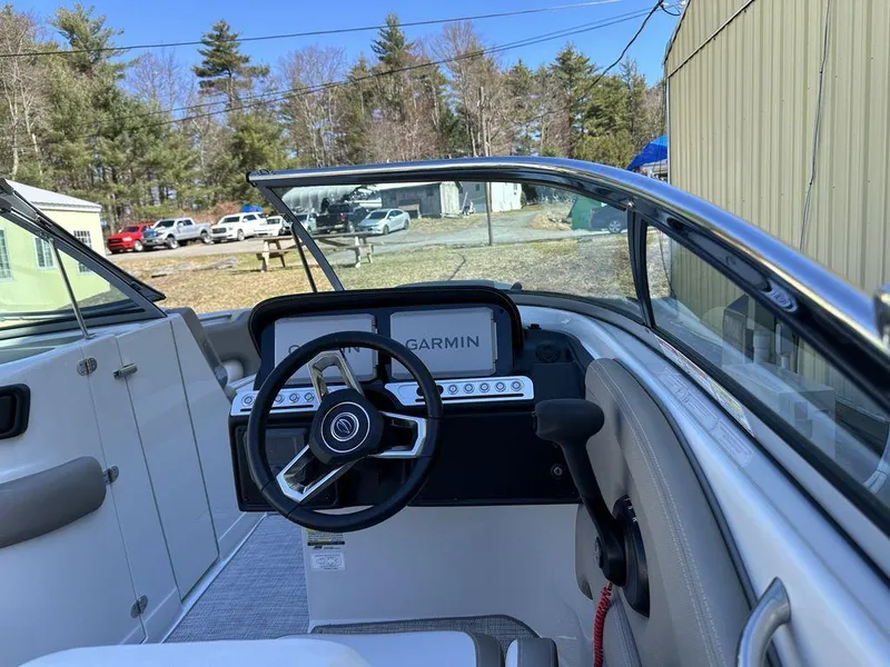 Slide: The Image of 2024 Crownline XSS Series 250 boat cockpit with Garmin navigation system. - 8