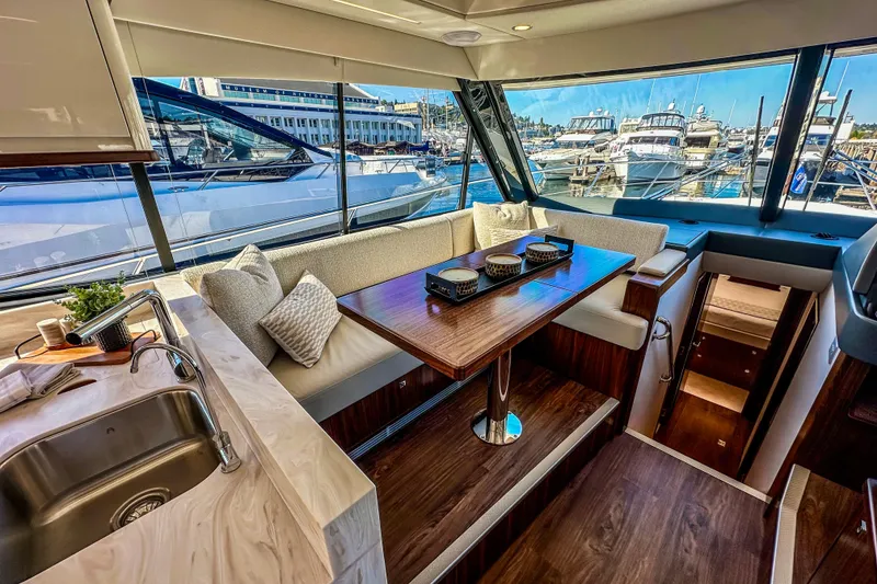 Slide: The Image of Aerial view of 2026 Riviera 505 SUV luxury yacht cruising on open water. - 10