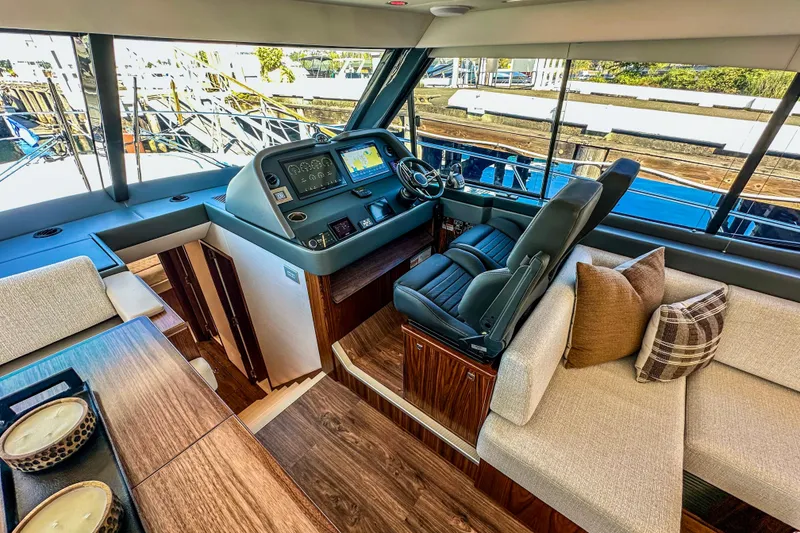 Slide: The Image of Aerial view of 2026 Riviera 505 SUV yacht cruising on blue water. - 11