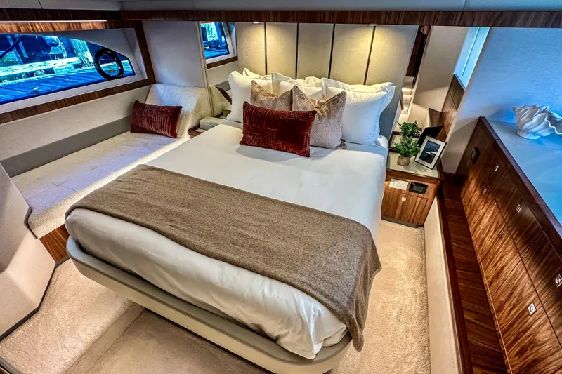 Slide: The Image of 2026 Riviera 505 SUV luxury yacht with spacious deck and elegant interior on blue water. - 13