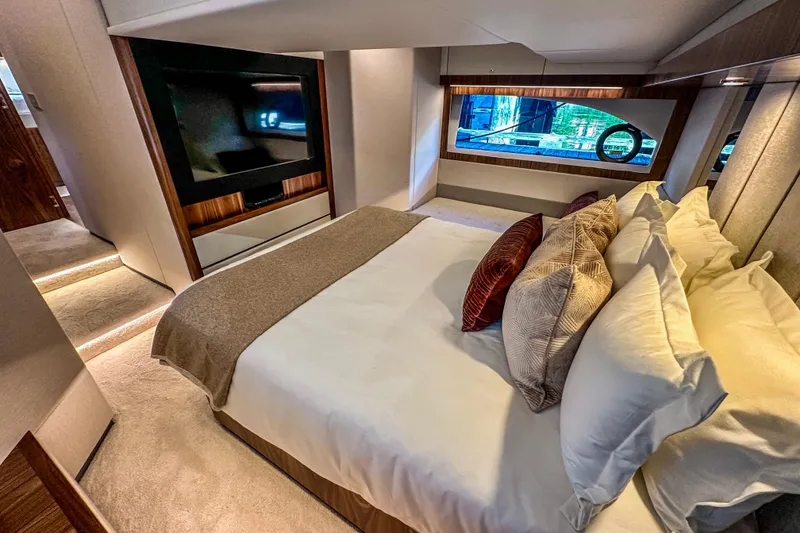 Slide: The Image of Aerial view of 2026 Riviera 505 SUV yacht cruising on blue water. - 14