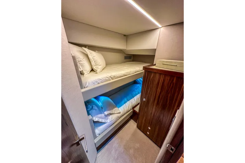 Slide: The Image of Luxurious interior of 2026 Riviera 505 SUV yacht with modern kitchen and scenic window view. - 25