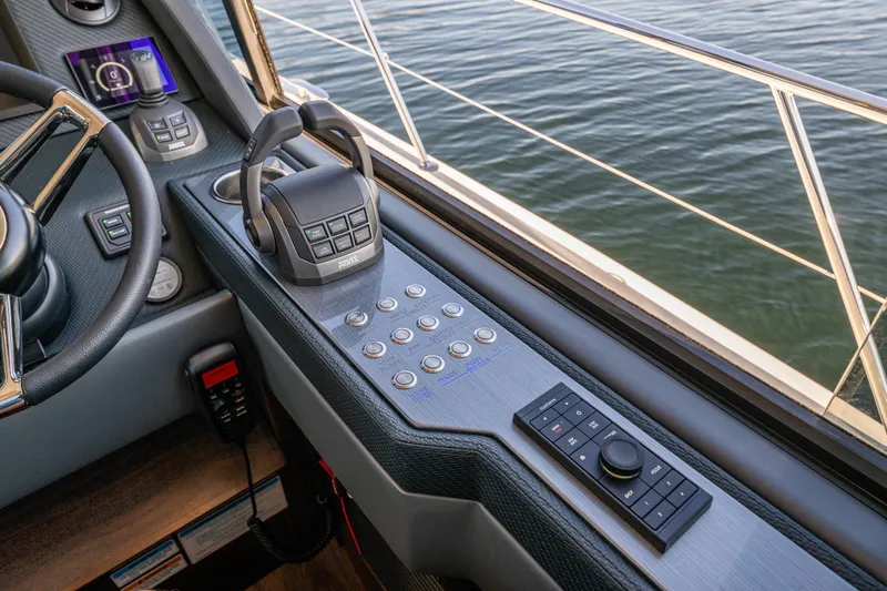 Slide: The Image of 2026 Riviera 505 SUV helm with advanced controls and water view. - 36