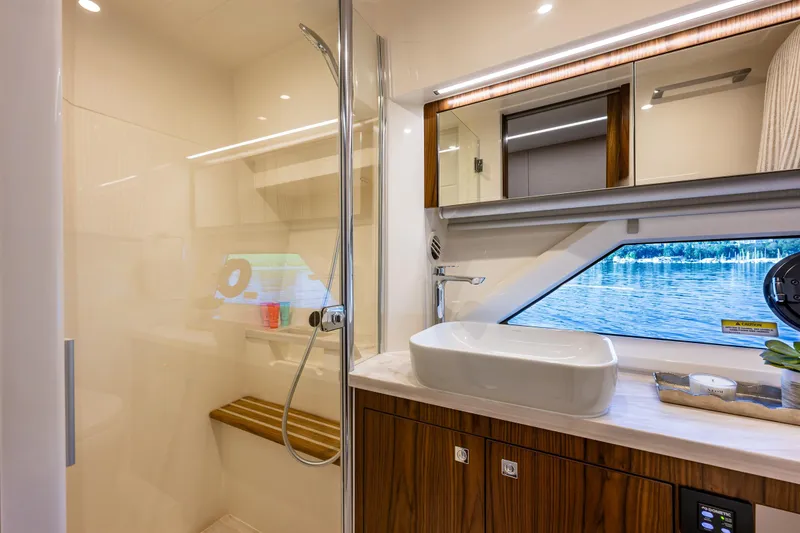 Slide: The Image of Luxurious bathroom interior of 2026 Riviera 505 SUV yacht with lake view. - 43