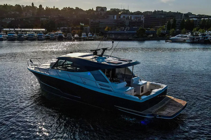 Slide: The Image of 2026 Riviera 505 SUV luxury yacht on calm blue water. - 5