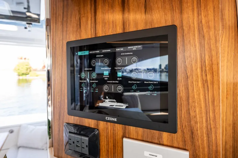 Slide: The Image of Touchscreen control panel on 2026 Riviera 505 SUV yacht, displaying various system settings. - 50