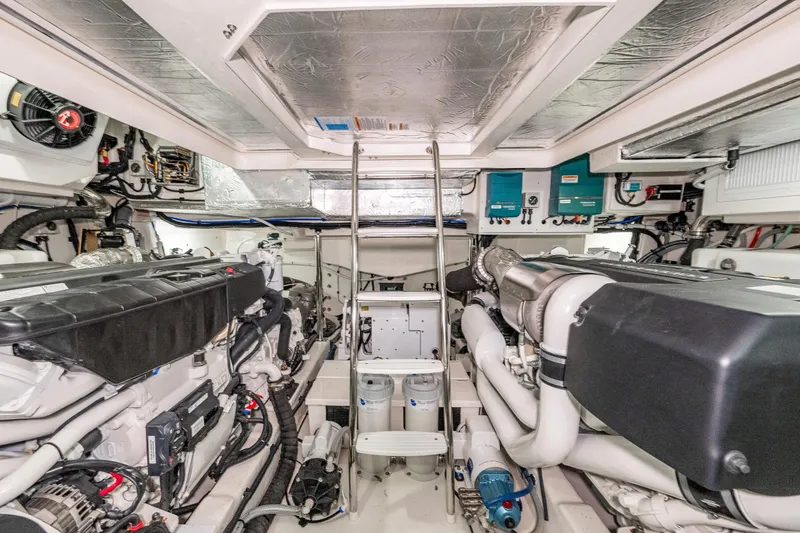 Slide: The Image of Engine room of 2026 Riviera 505 SUV, showcasing advanced marine machinery and equipment. - 51