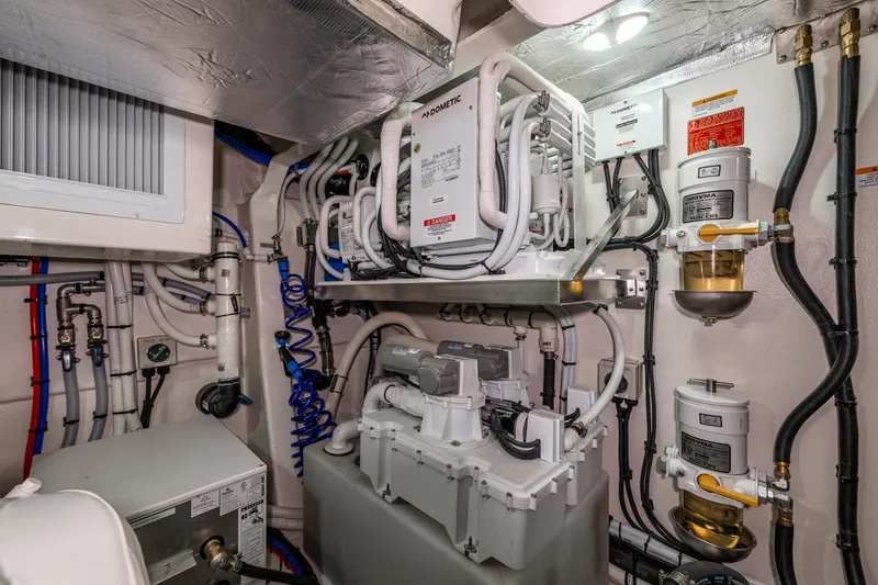 Slide: The Image of Engine room of 2026 Riviera 505 SUV, showcasing complex machinery and piping systems. - 55