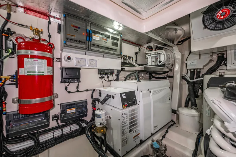 Slide: The Image of Engine room of 2026 Riviera 505 SUV with generator and fire extinguisher. - 56