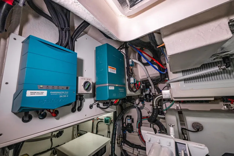 Slide: The Image of Engine room of 2026 Riviera 505 SUV with battery chargers and wiring. - 60