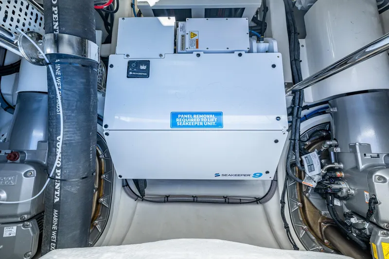 Slide: The Image of Engine room of 2026 Riviera 505 SUV featuring Seakeeper 9 stabilizer system. - 62