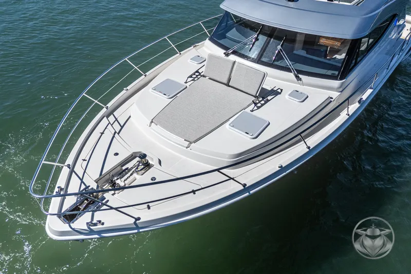 Slide: The Image of 2025 Riviera 465 SUV yacht on water, featuring sleek design and spacious deck. - 1