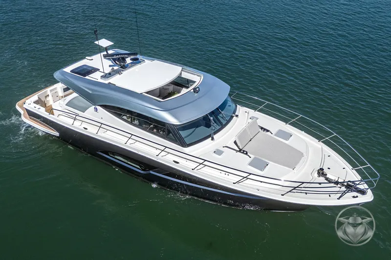 Slide: The Image of 2025 Riviera 465 SUV luxury yacht cruising on open water. - 16