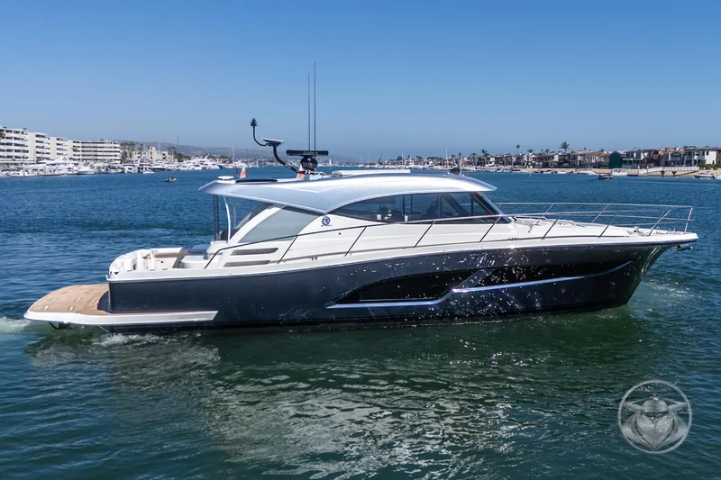 Slide: The Image of 2025 Riviera 465 SUV yacht cruising in a sunny marina. - 17