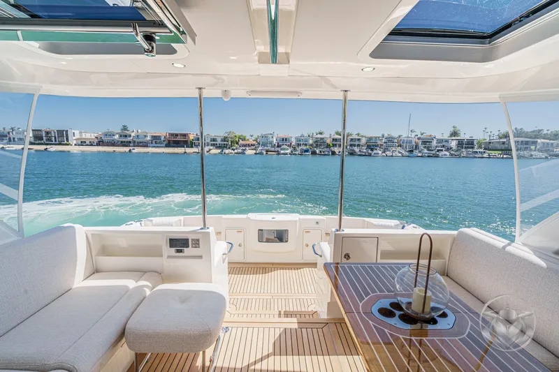 Slide: The Image of Luxurious interior of 2025 Riviera 465 SUV yacht with waterfront view. - 31