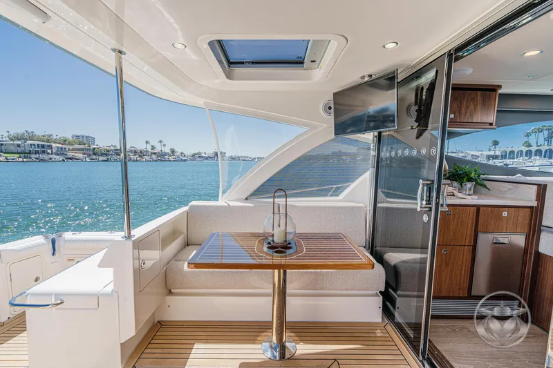 Slide: The Image of Luxurious interior of 2025 Riviera 465 SUV yacht with waterfront view. - 32