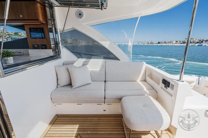 Slide: The Image of Luxurious seating area on 2025 Riviera 465 SUV yacht with ocean view. - 33