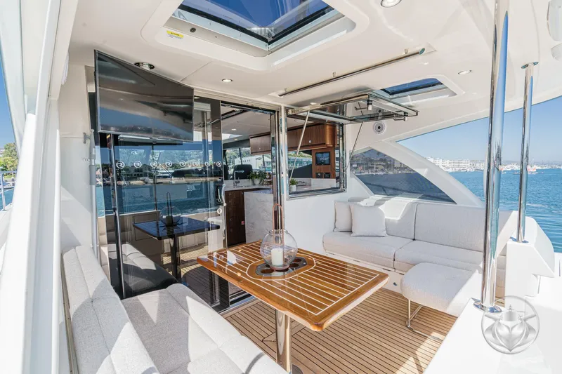 Slide: The Image of Luxurious interior of 2025 Riviera 465 SUV yacht with elegant seating and ocean view. - 34