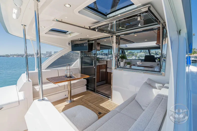 Slide: The Image of Luxurious 2025 Riviera 465 SUV yacht interior with elegant seating and scenic ocean view. - 35