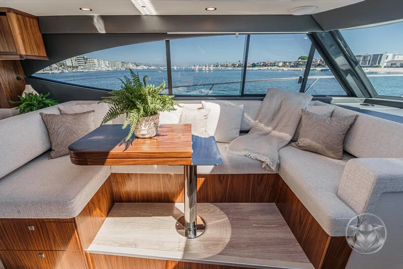 Slide: The Image of Luxurious interior of 2025 Riviera 465 SUV yacht with elegant seating and ocean view. - 43