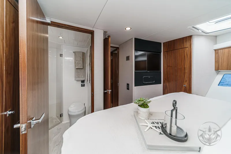 Slide: The Image of Luxurious interior of 2025 Riviera 465 SUV yacht featuring modern bathroom and elegant decor. - 48