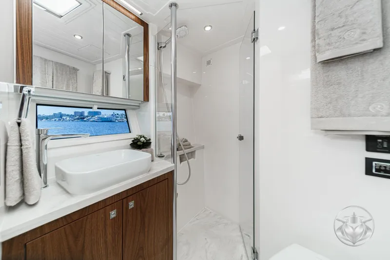 Slide: The Image of Luxurious bathroom interior of 2025 Riviera 465 SUV yacht with modern fixtures and ocean view. - 7