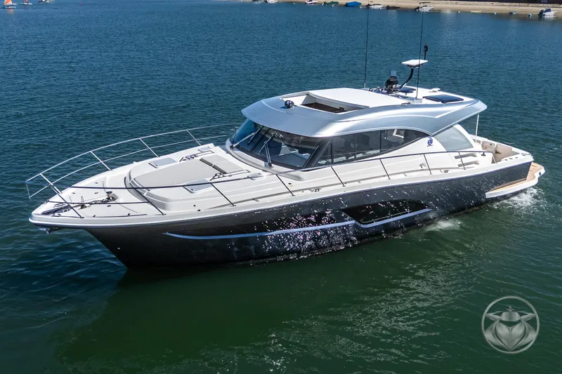 Slide: The Image of 2025 Riviera 465 SUV luxury yacht cruising on calm waters. - 9