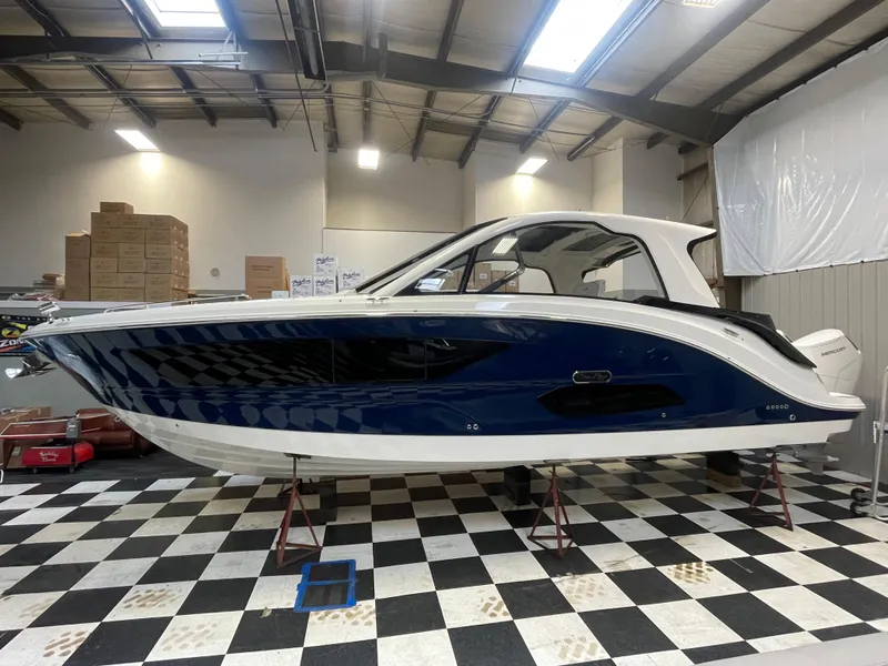 Slide: The Image of 2023 Sea Ray Sundancer 370 OB in showroom on checkered floor. - 0
