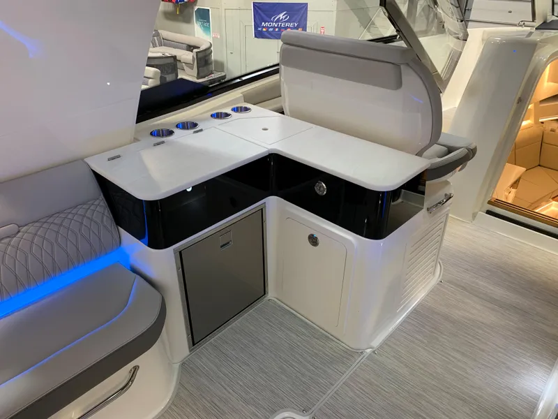 Slide: The Image of Interior of 2023 Sea Ray Sundancer 370 OB yacht with modern seating and storage. - 12