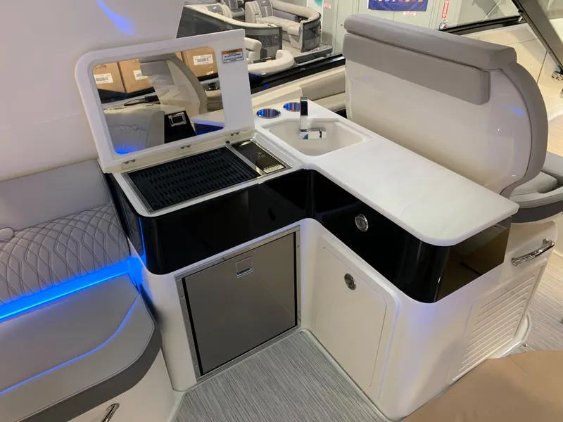 Slide: The Image of 2023 Sea Ray Sundancer 370 OB interior with kitchenette and seating area. - 13