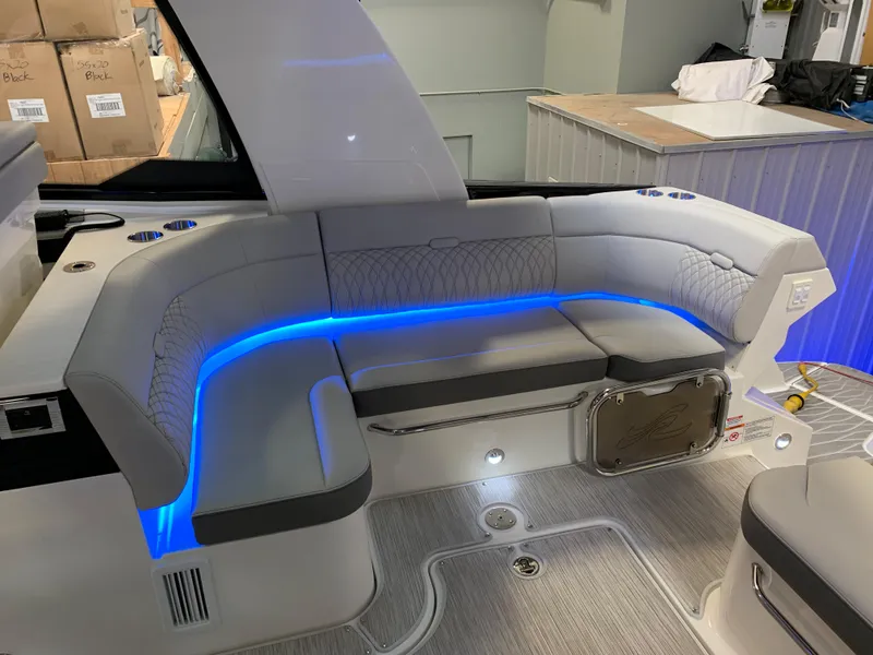 Slide: The Image of 2023 Sea Ray Sundancer 370 OB interior seating with blue LED lighting. - 14