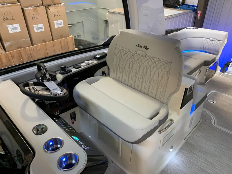 Slide: The Image of 2023 Sea Ray Sundancer 370 OB interior with helm and seating area. - 16