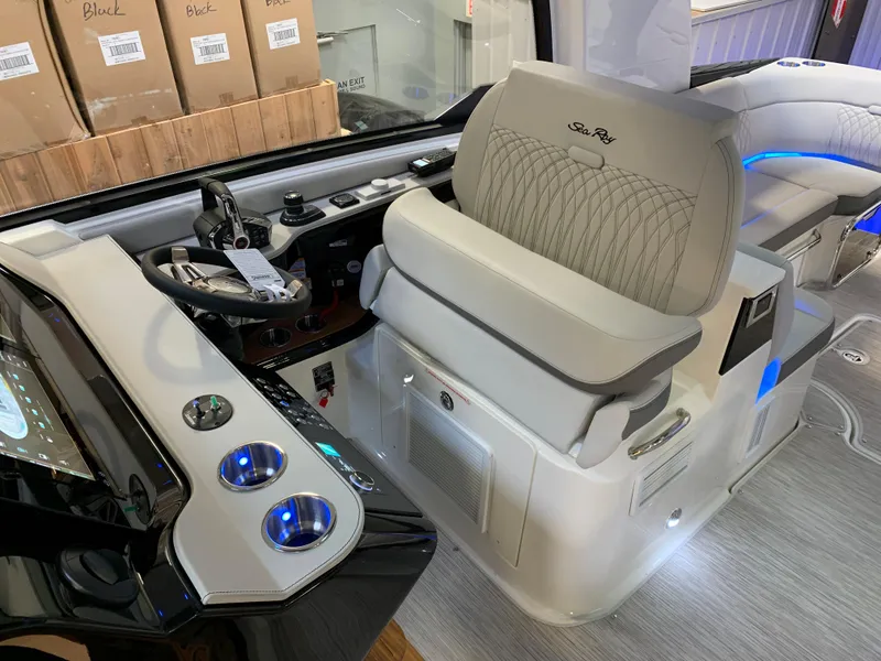 Slide: The Image of 2023 Sea Ray Sundancer 370 OB cockpit with modern controls and luxurious seating. - 17