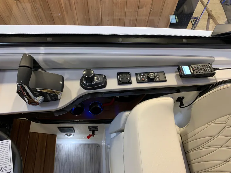 Slide: The Image of 2023 Sea Ray Sundancer 370 OB helm controls and dashboard. - 18