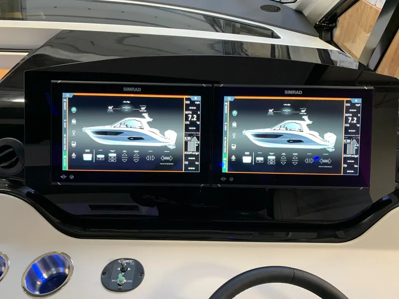 Slide: The Image of Dual Simrad displays on the 2023 Sea Ray Sundancer 370 OB dashboard. - 19