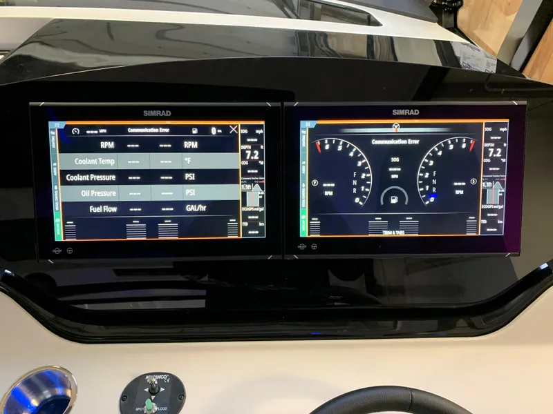 Slide: The Image of Dual Simrad displays on 2023 Sea Ray Sundancer 370 OB dashboard showing engine metrics. - 21